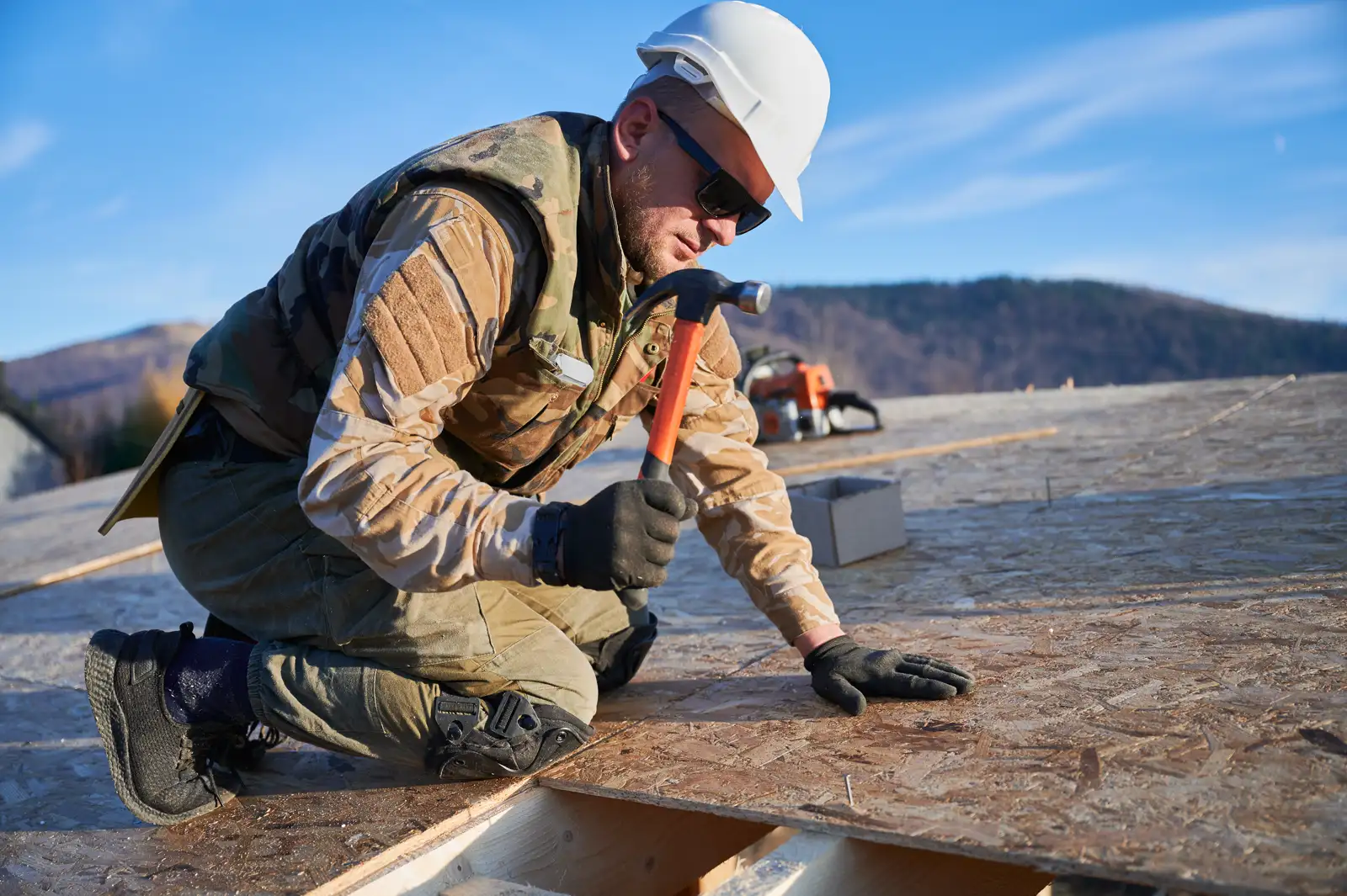 Roofing Handyman crew repairing a roof in Phoenix, AZ